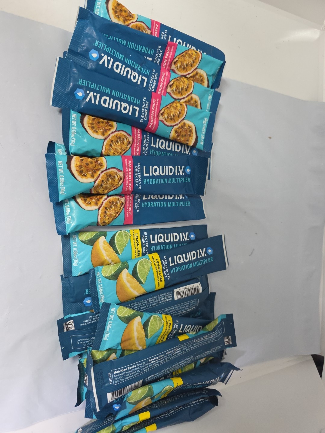 Liquid IV Passion fruit/Lemon Lime 0.56oz Ea. Hydration P Mix 24 packets. E1/27